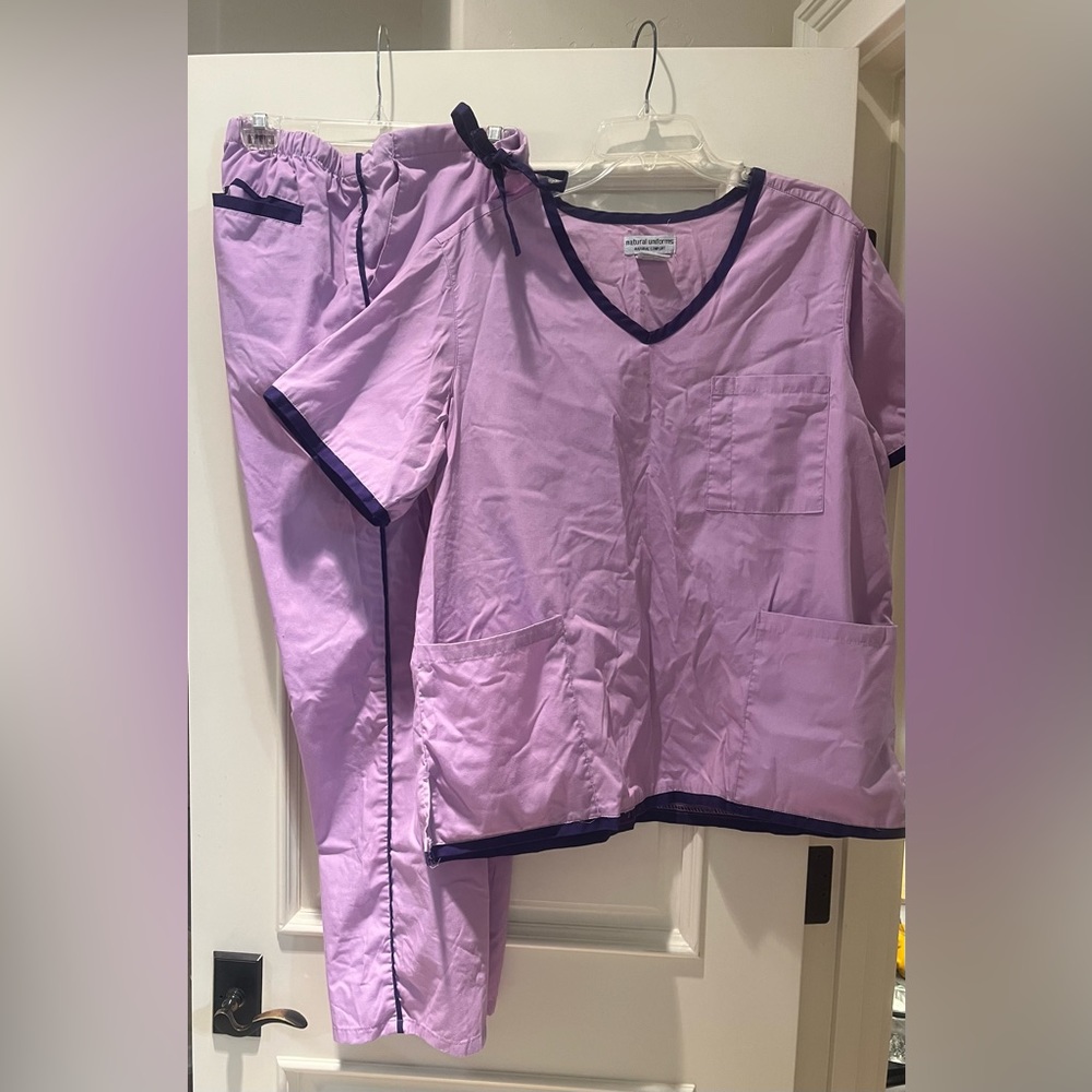 One set of purple scrubs by natural uniforms, size large